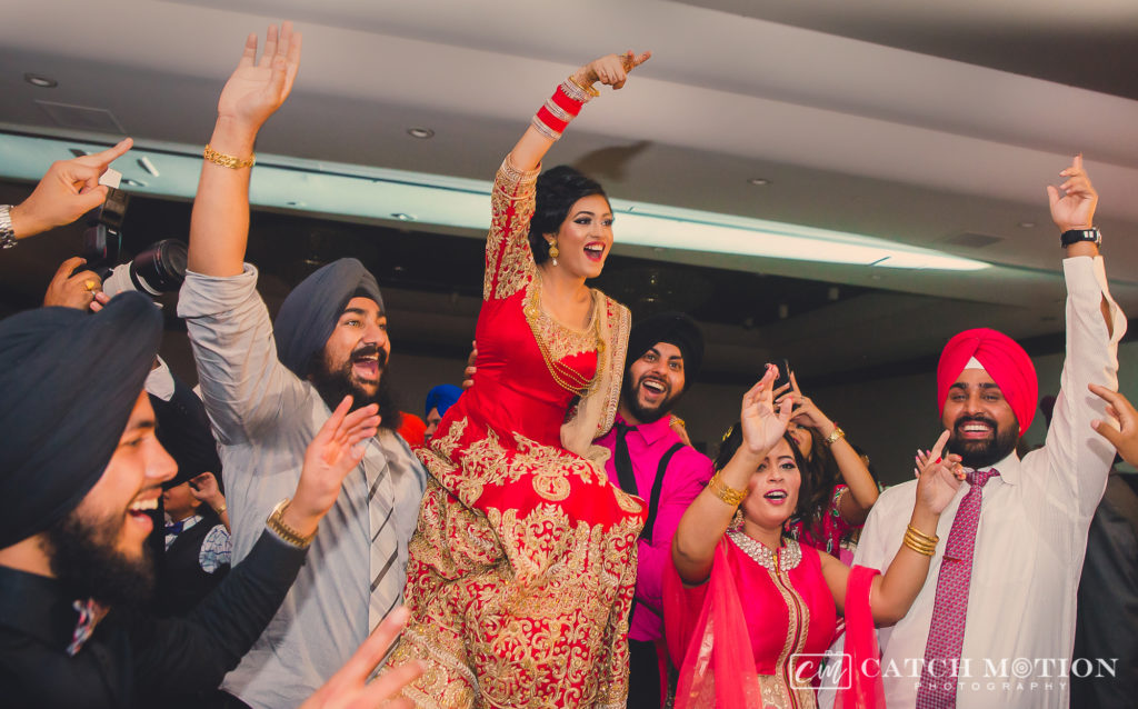 punjabi bride dancing on wedding reception 