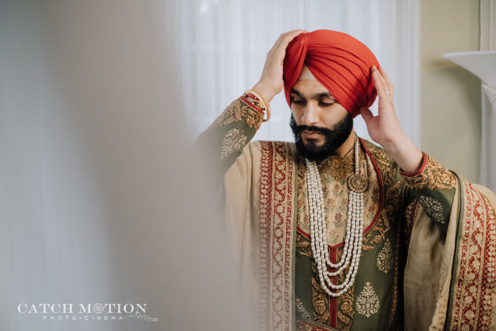 Close up of Sikh groom getting ready